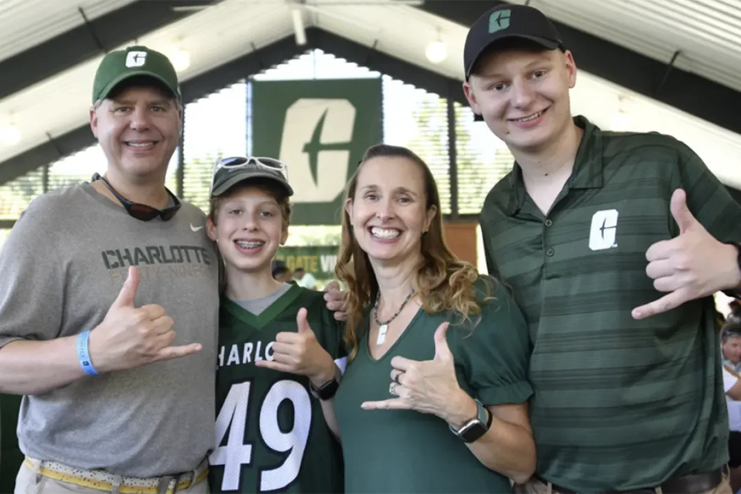 Family of four tailgating at Family Weekend